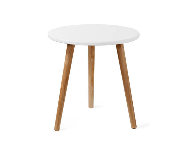 istockphoto-1411619454-612x612 Round coffee table or end table in scandinavian style, isolated on white background with clipping path. Small round white table with 3 wooden legs on white background.